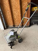 Full tiller showing handle, wheels and motor housing