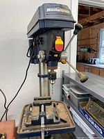 Front view of Mastercraft drill press mounted on table