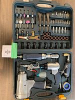 Overall view of open case showing air tools and accessories