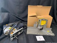 Overall view of jigsaw and miter box with box