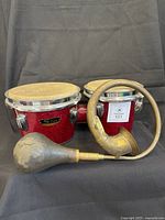 Star red sparkle bongos and brass horn full view