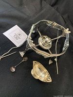 Tripod stand, dish, spoon and pick layout