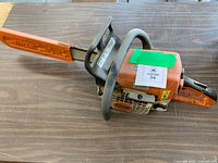 Full view of Stihl MS 250 chainsaw with bar cover