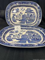 Two blue willow platters overall view