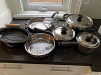 All cookware pieces arranged on countertop