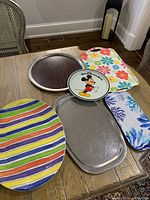 All six assorted serving trays and platters displayed on table