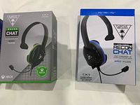 Boxes of Xbox and PS4 Turtle Beach Recon Chat headsets