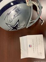 Helmet left side with Jason Witten signature, COA envelope beside