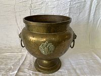 Full view of footed brass planter urn