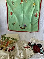 Group shot showing all four tablecloths in lot