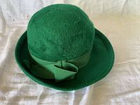 Full view of green beaver felt hat with ribbon and bow