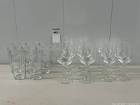 Group view showing 12 wine glasses and 8 pint tumblers