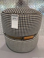 Full view of cylindrical houndstooth stool with MaxSold tag