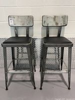 Two Dulton steel bar stools front view