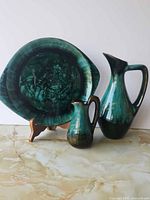 Front view of plate, ewer and creamer showing glaze and form