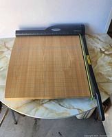 Top view showing entire wooden base and cutting arm