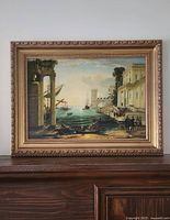 Front view of framed seaport painting on mantel