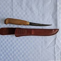 Knife and sheath laid out showing full view