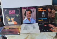 Front covers of six records including Julio Iglesias, Roger Whittaker, Dalida, Alain Morisod Sweet People, André Gagnon and one of the Mireille Mathieu albums