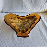 Top view of amber art glass centerpiece showing overall shape and interior swirl