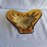 Top view showing amber body and cream starburst interior