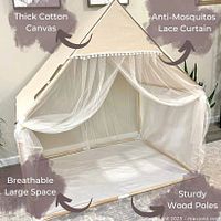 Assembled tent displaying canvas material, pom-lace trim, net curtains and inner space