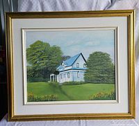 Front view of framed painting showing scene, mat and frame