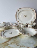 Overall view of all eight Ivory pattern serveware pieces