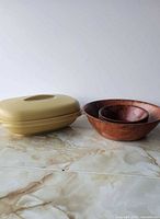Tupperware steamer and nested wooden bowls