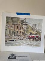 Full view of unframed print with bio sheet visible