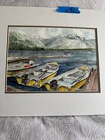 Full view of matted watercolor showing boats and mountains