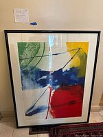 Front view of framed artwork showing abstract composition and mat