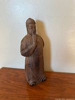 Front view of carved wooden statue