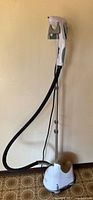 Full view of upright HOME Touch garment steamer assembled