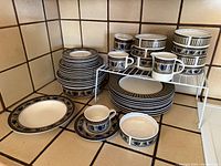 Entire dish set arranged on counter showing all piece types