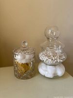 Both glass jars side-by-side showing design and lids