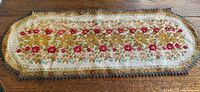 Full view of oval tapestry runner