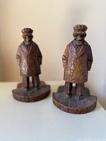 Front view of both carved sea captain bookends