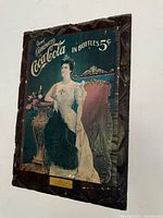 Front view of vintage Coca-Cola Nordica advertisement showing full artwork and condition