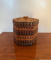 Front view of lidded sweetgrass basket