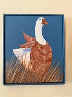 Full view of framed duck painting