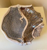 top view showing full platter, lace texture, leaf motif, vine detail