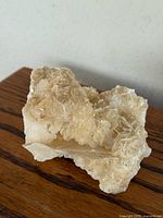 Overall view of mineral specimen on wooden surface
