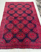 Full view of the entire rug showing size, pattern and overall condition