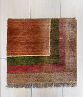 Front view showing colors, design and fringe