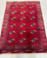 Full view of Turkman rug showing entire pattern and borders