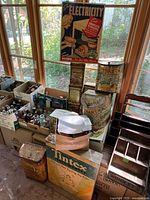 Group shot of stacked tins, boxed bottles and Tintex display