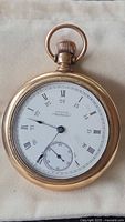 Front view of gold-tone American Waltham pocket watch