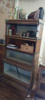 Full view of three-section oak barrister bookcase with contents removed