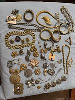 Full spread of all costume jewellery pieces laid out on cloth